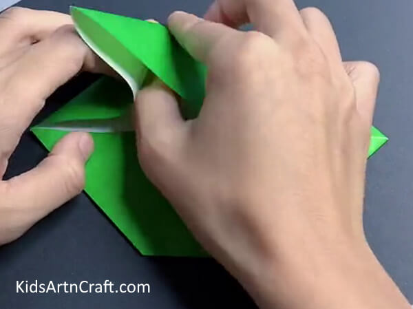 Making Folds On the Corner - Crafting a paper dinosaur with origami steps