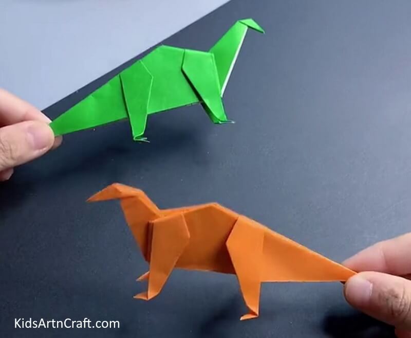 Paper Dinosaur Origami Craft Is Finished! - Learn the steps to make a dinosaur paper craft with origami.