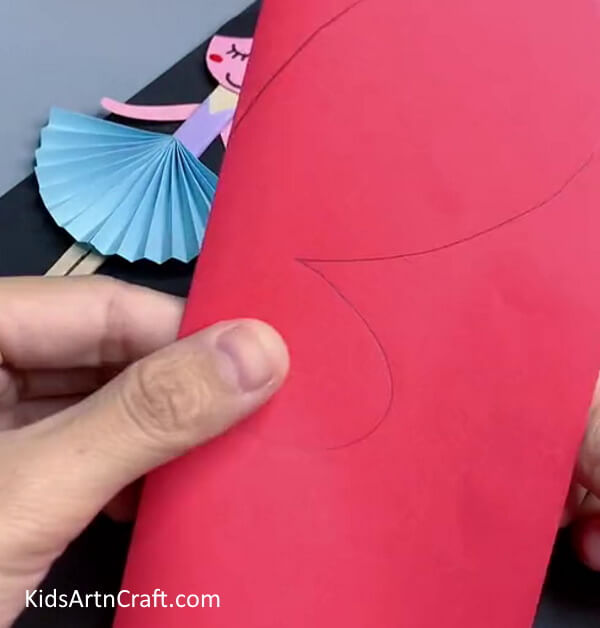 Take The Paper And Create Wings Outline Creating a Paper Doll out of Craft Paper 