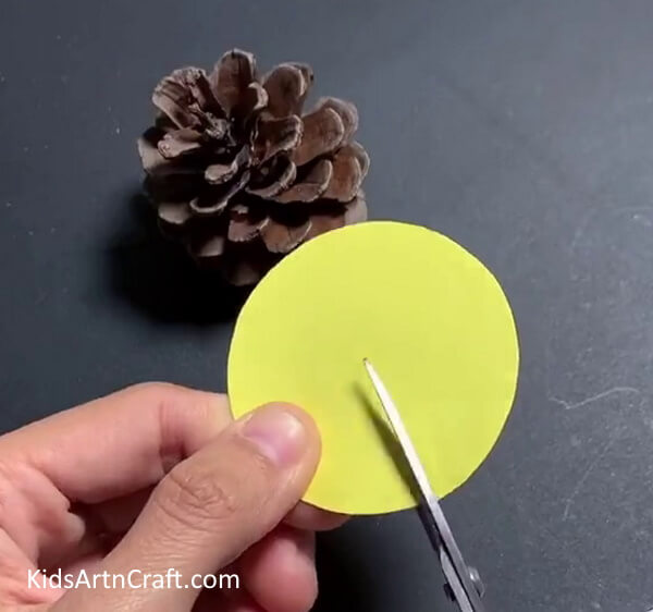 Cutting A Yellow Circle - Construct a Simple Mouse Out of Pine Cones for Children