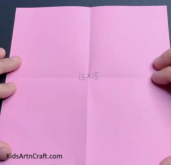 Folding Square Pink Paper - This is a straightforward tulip paper flower craft for children. 