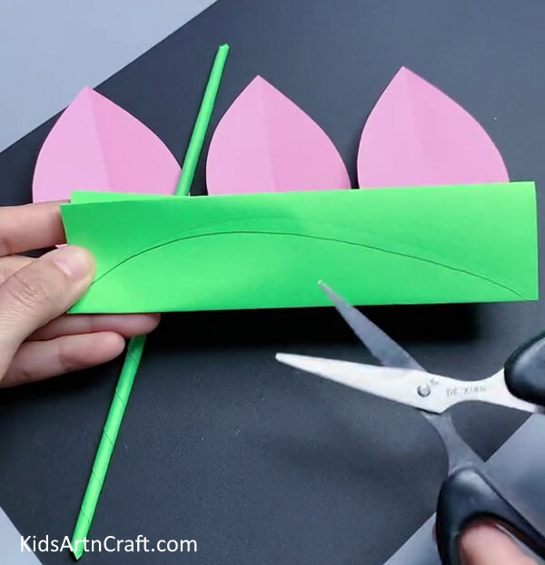 Cutting Leaf Out Of Green Paper - Creating a Tulip Out of Paper - A Fun Activity for Little Ones 