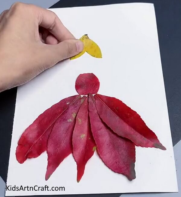 Pasting leaves for hairstyle. Complete tutorial on how to make fall leaf artwork for kids