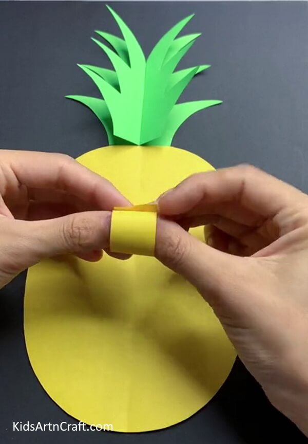 Folding Yellow Sheets - Construct a 3D Paper Pineapple Craft with Children