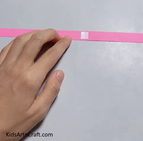 Pasting Tape On Strips A Step-by-Step Guide to Making an Apple Craft