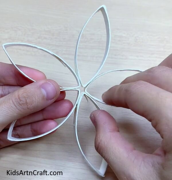 Gluing The Pieces Together-Here is a tutorial on how to form easy paper snowflakes 