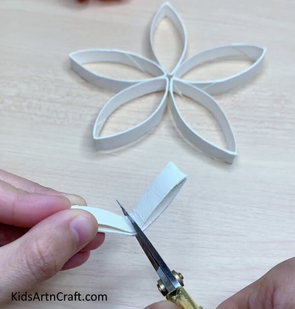 Cutting The Rest Of The Pieces Into Halves-This tutorial will explain how to construct straightforward paper snowflakes