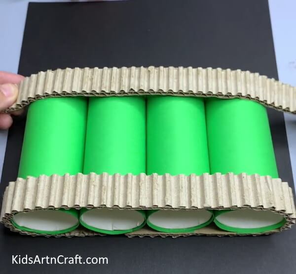Pasting Cardboard Strips - Produce a Recycled Cardboard Tube & Paper Cup Battle Tank Craft From Home