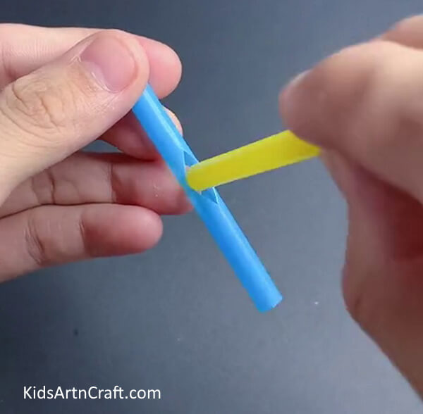 Inserting Another Straw In the Hole - Craft A Handmade Straw Fan Craft For Children With This Guide