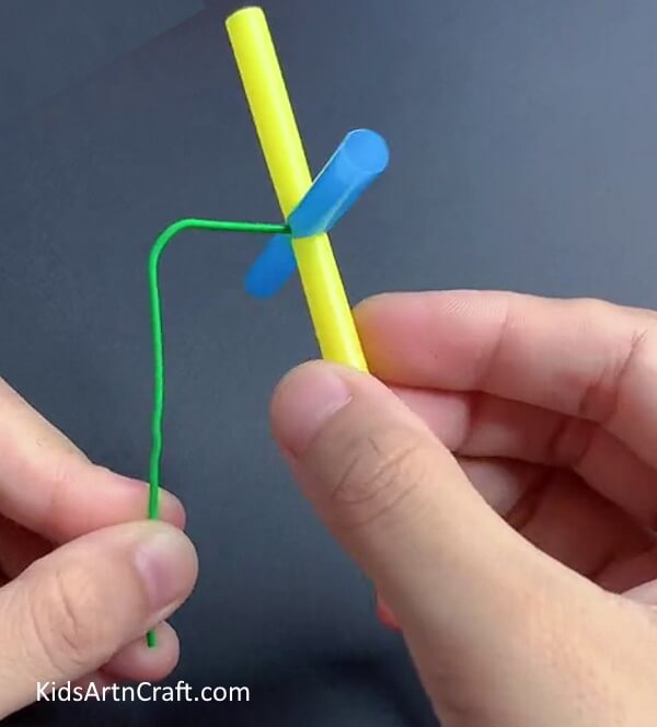 Inserting Paper Clip - Make A Straw Fan Craft For The Kids With This Tutorial