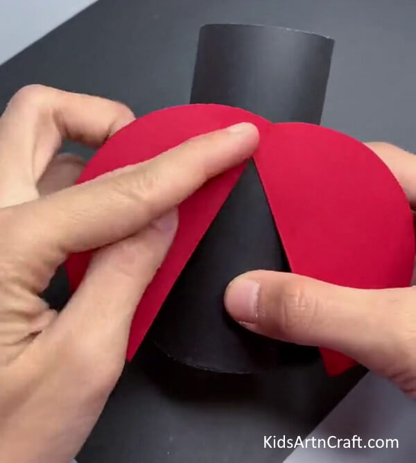 Constructing a Ladybug out of a Toilet Paper Roll