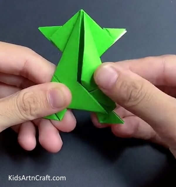 Follow these steps to create a paper frog using origami 