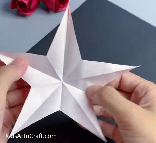 Unfolding And Checking The Creases- Learn How to Make a Paper Star with Origami 