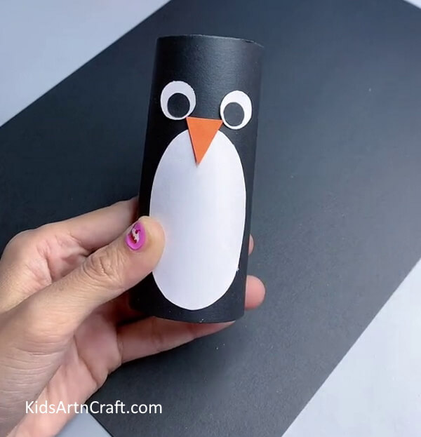 Pasting Nose - Crafting a penguin from a toilet roll for youngsters