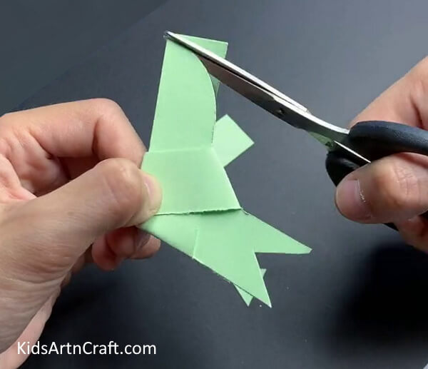 Cutting the Upper Part in a Curve - Generating a Paper Sparrow in a Breeze