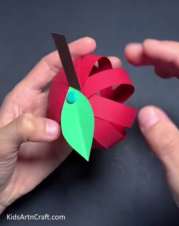 Separate Each Strip - A tutorial for making a paper strip apple craft with kids.