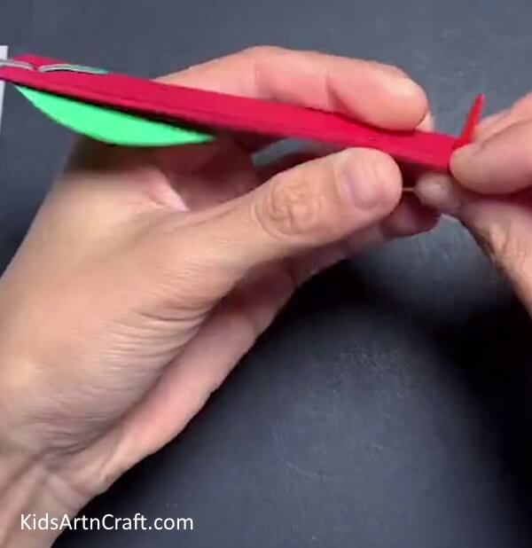 Pushing Fasteners - A paper strip apple craft tutorial for kids.