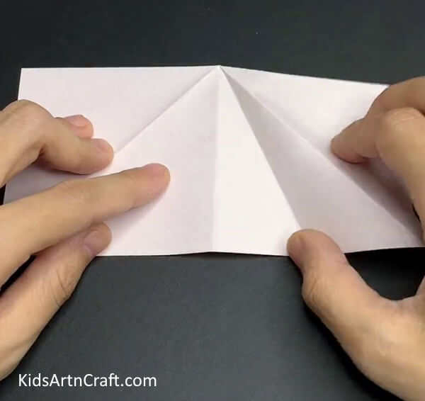 Making Creases on Folded Paper - Step-by-Step Guide on How to Make a Fall Leaf Craft Out of Recycled Paper