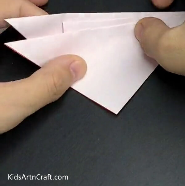 Folding Third and Last Crease - Instructions on Crafting a Fall Leaf Using Repurposed Paper and Kids