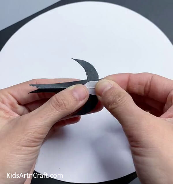 Pasting White Oval On Bird - Crafting a Bird Artwork Using Paper 