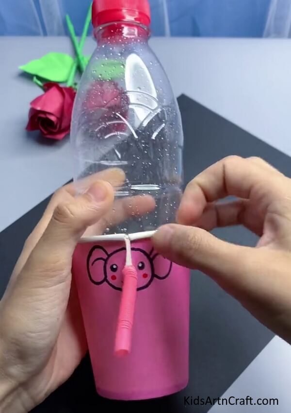 Putting Bottle In Paper Cup - Building a Repurposed Water Dispenser with Plastic Containers and Straws