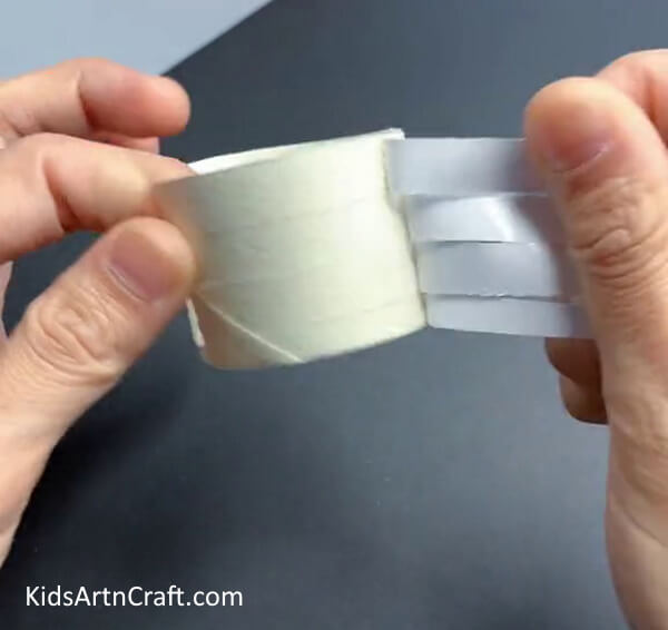 Uncover The Double-Sided Tape- Get the skill to design a flower bracelet with cardboard tubes. 