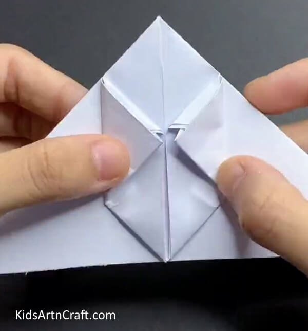 Inserting Corners Guiding Kids In Making A Paper Rabbit 
