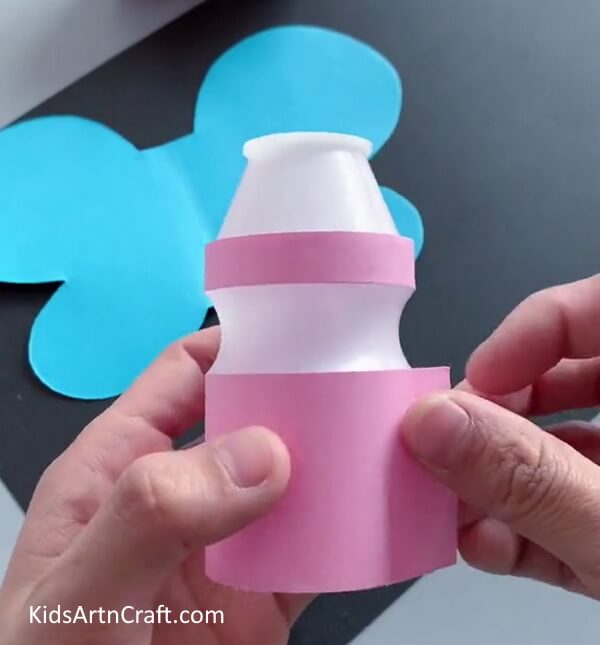 Covering Bottle With Paper - Make a Butterfly Craft Employing a Reutilized Bottle
