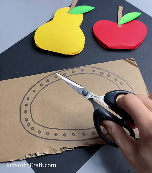 Cutting Cardboard - Guide your children in making a 3D paper fruit craft. 