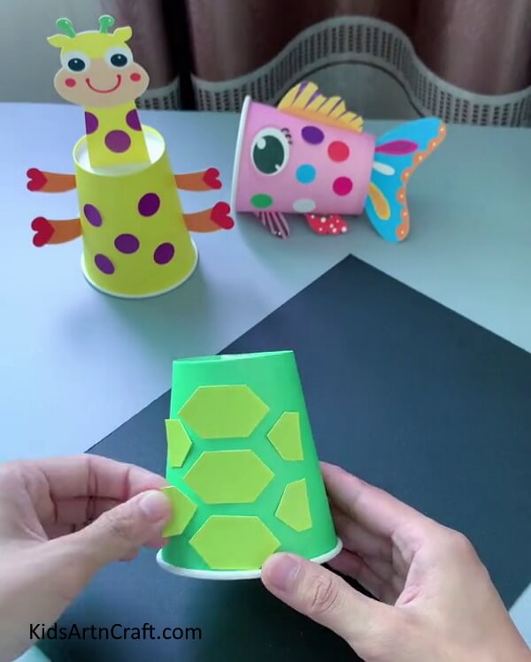 Cutting Pentagon With Scissors- Grasp the technique of constructing a Paper Cup Turtle that's easy for children. 