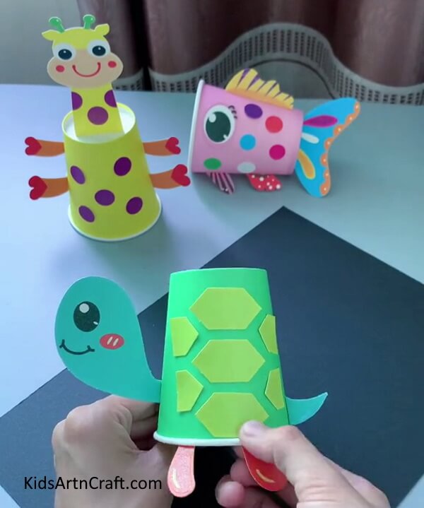 Makeing The Legs Of a Turtle With Red Craft Paper- Acquire the ability of making a basic Paper Cup Turtle that's ideal for young ones. 