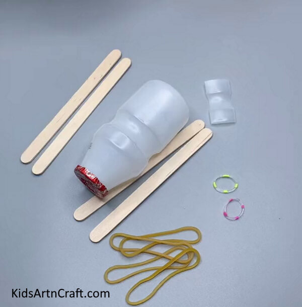 Getting Ready With Supplies - Constructing a Rubber Band Bottle Ship with Ice Pops Sticks