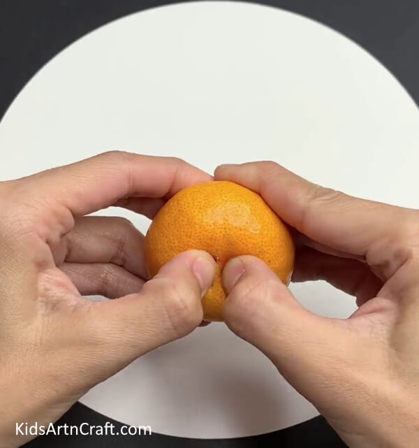 Taking Off Orange Peel - Instructions for making a craft using orange peels with children