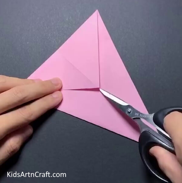 Cutting Slits For The Ears Crafting an Origami Bunny from Yellow Paper Sun - Step-by-Step Instructions for Kids 