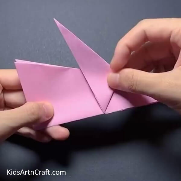 Folding The Flaps For The Bunny's Ears Step-by-Step Tutorial for Making an Origami Bunny with Yellow Paper Sun - Designed for Kids 