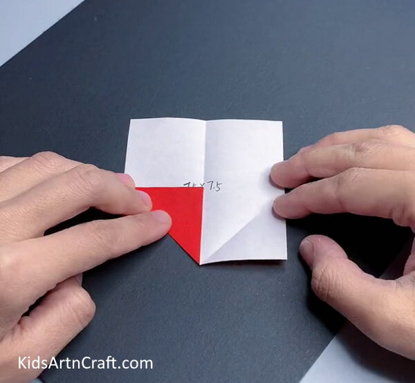 Making A Fold At The Corner - Kids Can Create An Origami Ninja Star With This Step-By-Step Guide