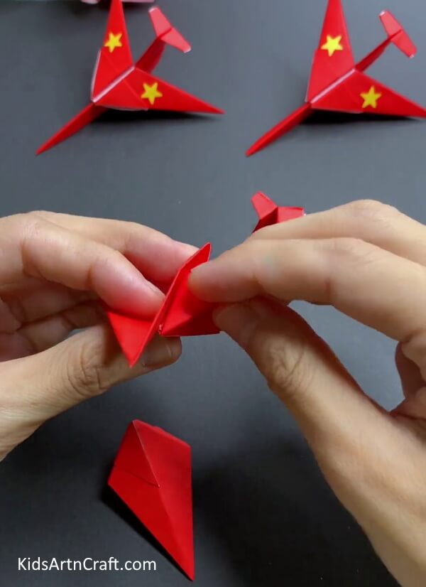Inserting Other Corner In Outer Pocket - Forming an Origami Aeroplane Out of Paper