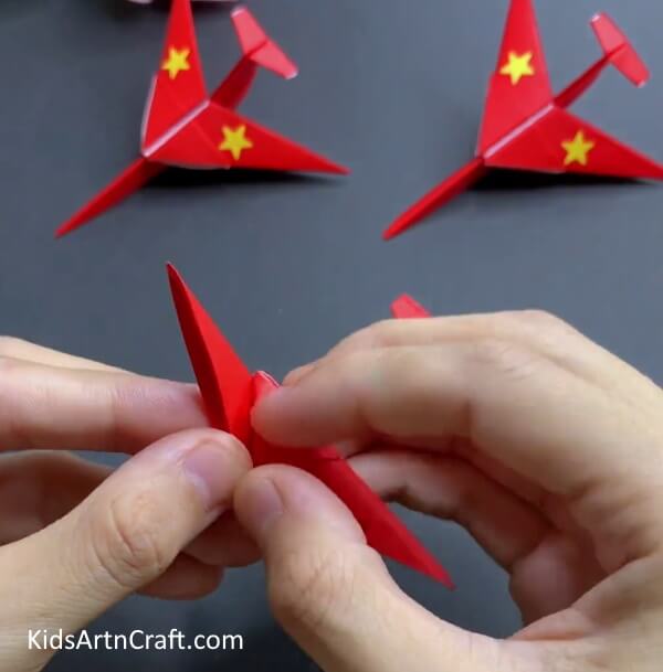 Inserting Corner In Outer Pocket - Building a Paper Airplane with Origami