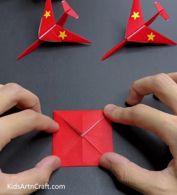Bringing Corners In The Middle - Crafting a Paper Plane with Origami