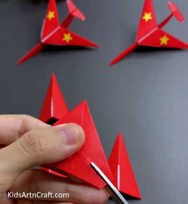 Making Small Cut In The Middle - Making a Paper Airplane with Origami