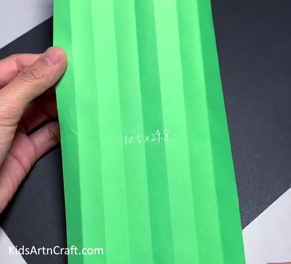 Folding Green Paper - Forming a Christmas Tree from Paper for Pre-Schoolers
