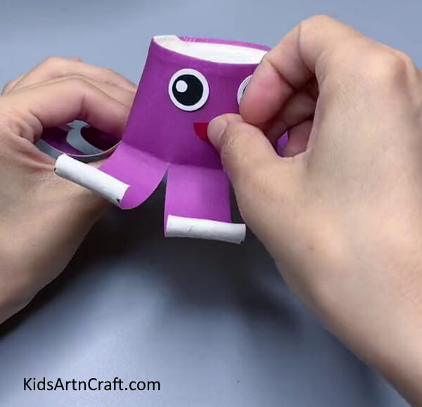 Adding A Mouth-Forming an Octopus Sculpture from Paper Cups for Toddlers