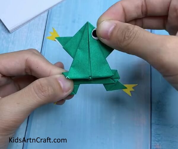 Adding Eyes - This paper origami tutorial is ideal for children who want to make a frog. 