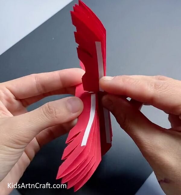 Attaching Four Designs Using Double Side Tape - A Snowflake Shape Craft Made With Paper