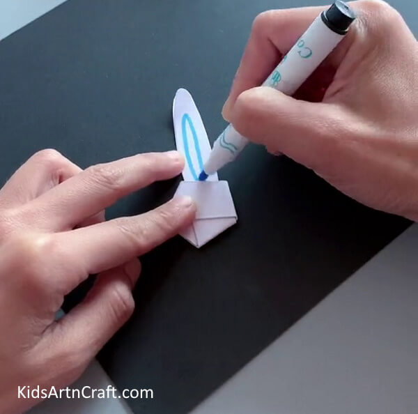 Create a Bunny Ear Shape Using a Marker- Forming a Bunny Face out of Paper Strips for the Tots