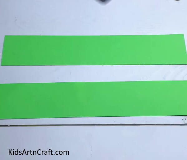 Cutting Wide Green Paper Strips - Construct a Frog Out of Paper Strips Through Doing It Yourself
