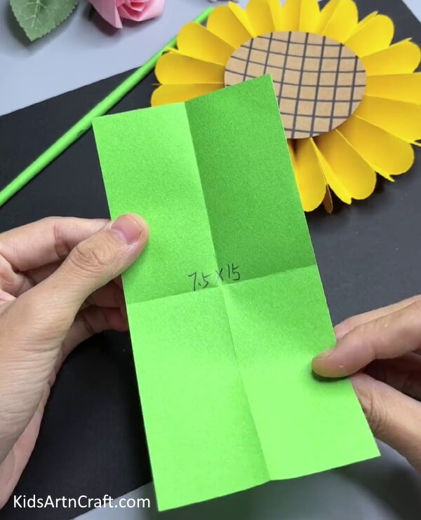 Taking A Green Paper and Creasing It - Creating a Paper Sunflower