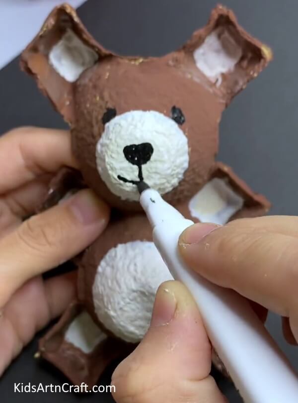 Adding Details - How Kids Can Make a Bunny from a Reused Egg Carton 