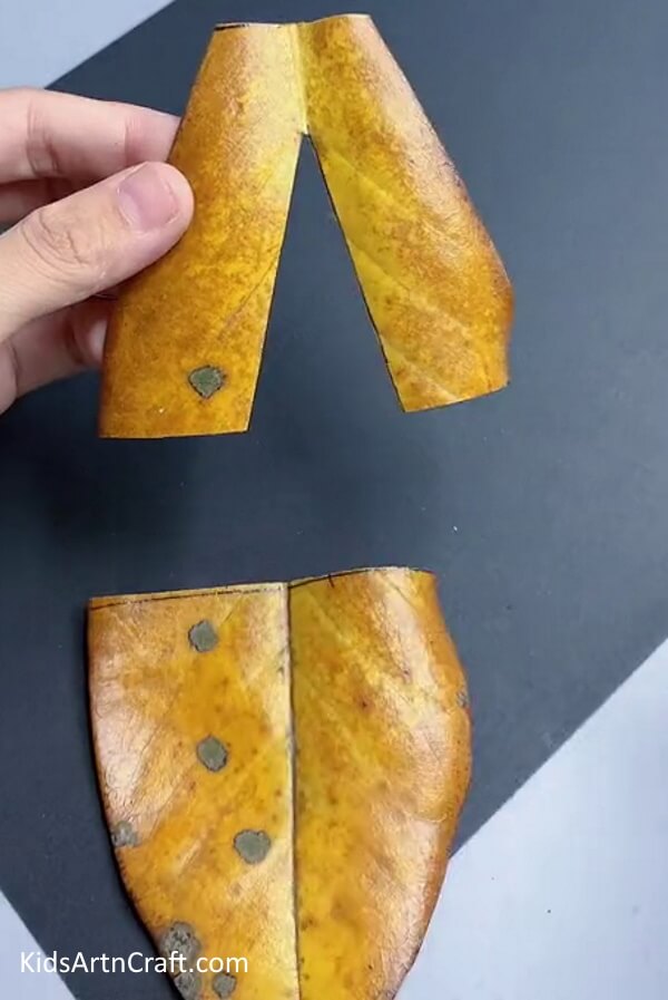 Cutting Pants Out Of Yellow Leaf - Tutorial on Creating a Boy Using Fallen Leaves with Step-By-Step Directions