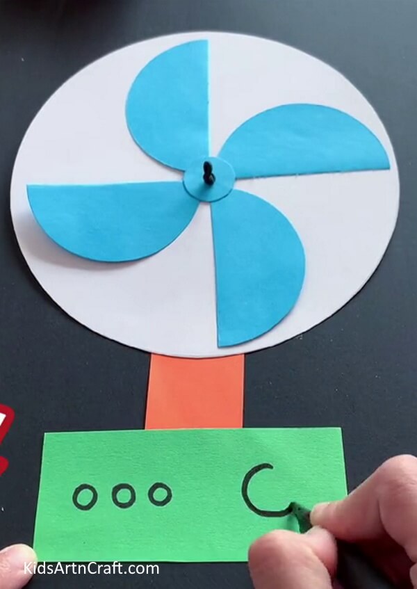Pasting The Stand and SwitchBoard - How to Make a Summertime Fan Using Paper - A Guide for Kids 